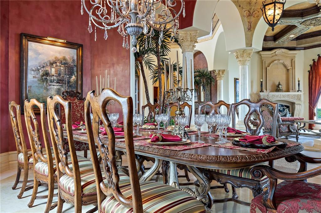 1025 Northeast Doubloon Drive Stuart, FL 34996 - Photo 44 of 69 a view of a dining room with furniture and chandelier