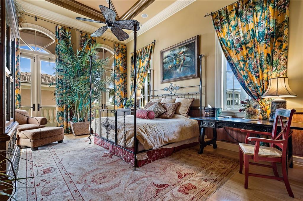 1025 Northeast Doubloon Drive Stuart, FL 34996 - Photo 46 of 69 a bedroom with a bed a table and chair
