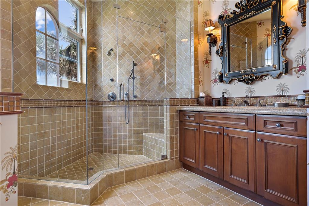 1025 Northeast Doubloon Drive Stuart, FL 34996 - Photo 47 of 69 a bathroom with a bathtub and a sink