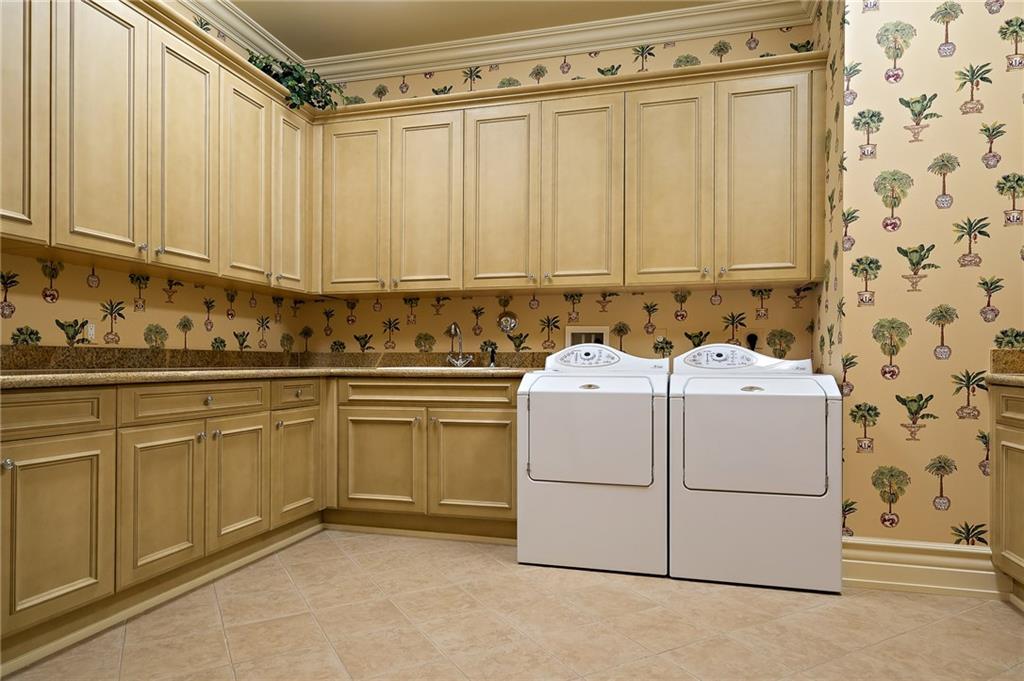 1025 Northeast Doubloon Drive Stuart, FL 34996 - Photo 58 of 69 a utility room with dryer and washer