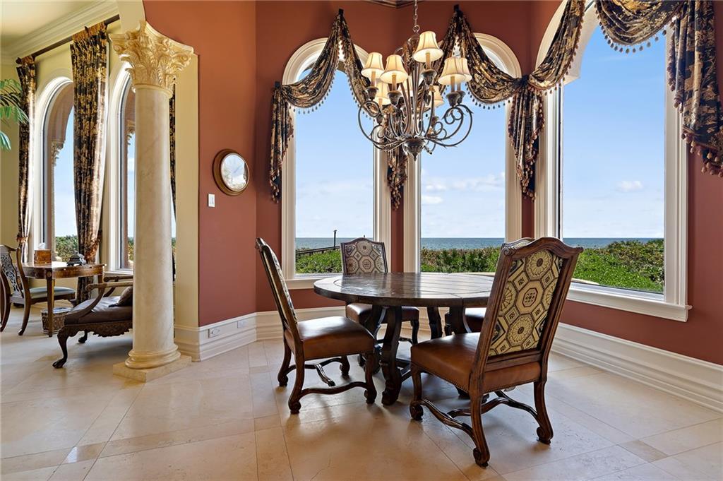 1025 Northeast Doubloon Drive Stuart, FL 34996 - Photo 6 of 69 a view of a dining room with furniture window and outside view