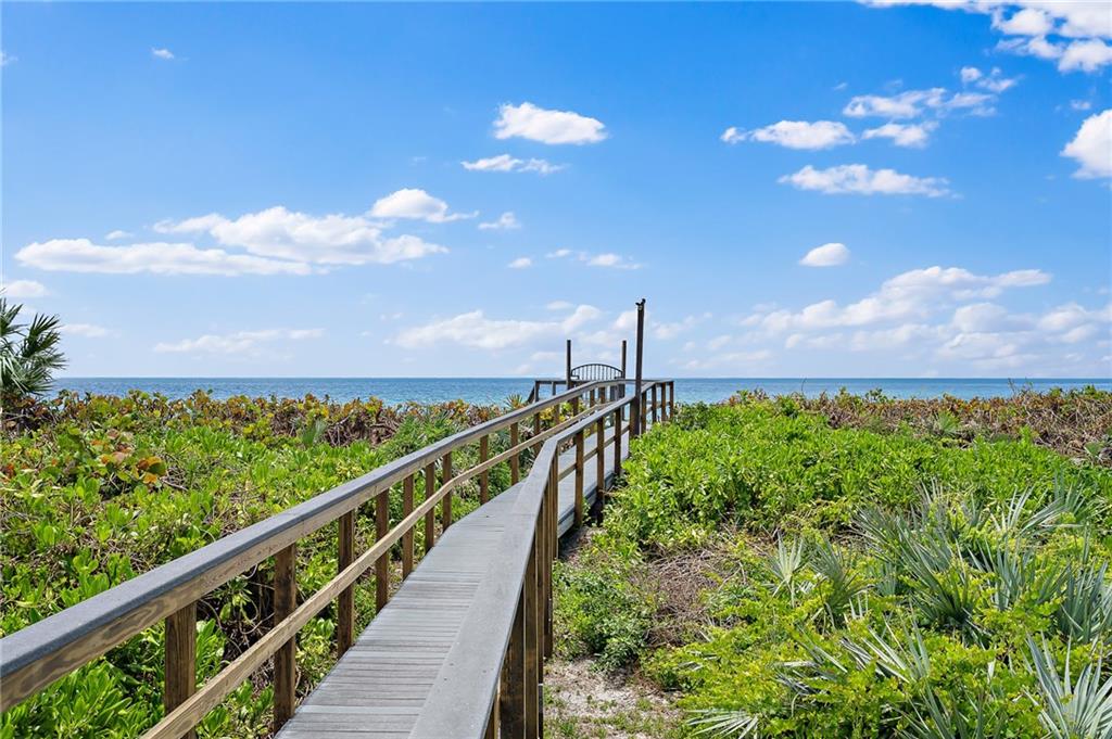 1025 Northeast Doubloon Drive Stuart, FL 34996 - Photo 68 of 69 a view of a city and a palm tree