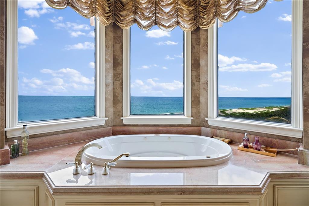 1025 Northeast Doubloon Drive Stuart, FL 34996 - Photo 10 of 69 a bath tub sitting next to a window