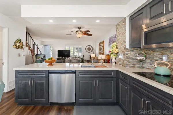 a spacious bathroom with a sink and a mirror