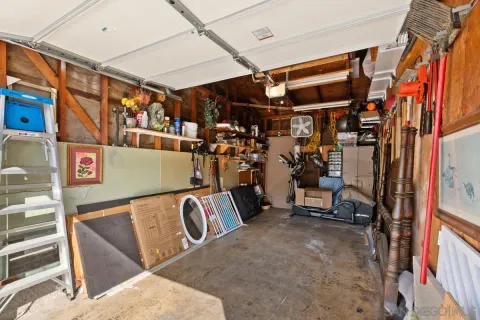 a view of a swimming pool with a patio and a yard