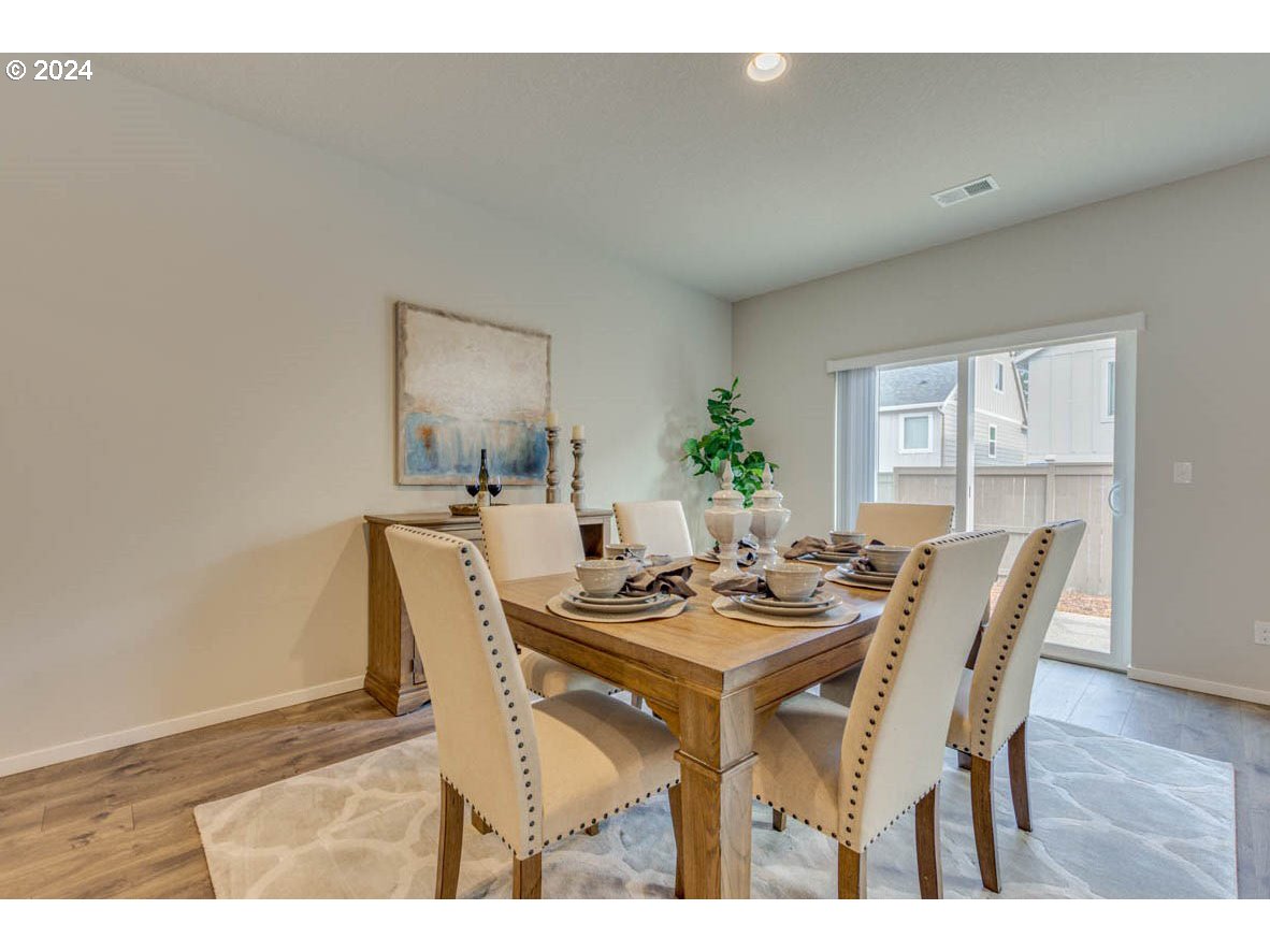 2604 26th Loop Springfield, OR 97477 - Photo 5 of 12 a dining room with furniture and wooden floor