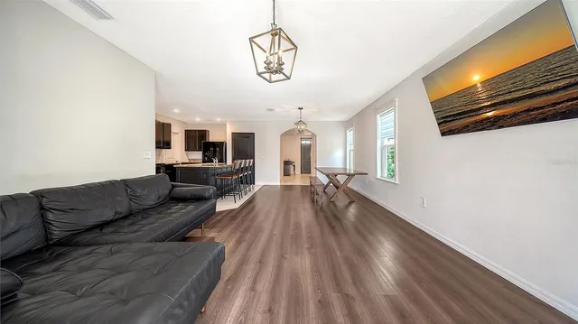 a bathroom with a granite countertop sink toilet mirror and shower