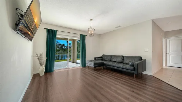 a bathroom with a granite countertop sink toilet mirror and shower