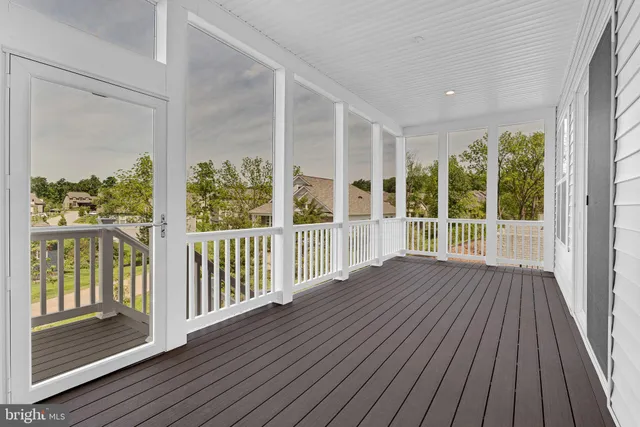 a view of balcony with wooden floor