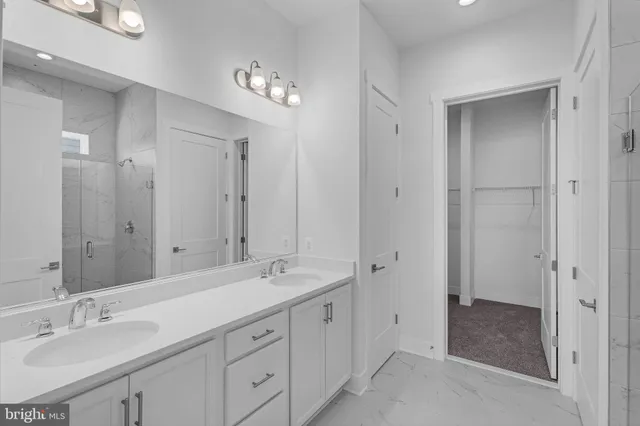 a spacious bathroom with double sink and a mirror