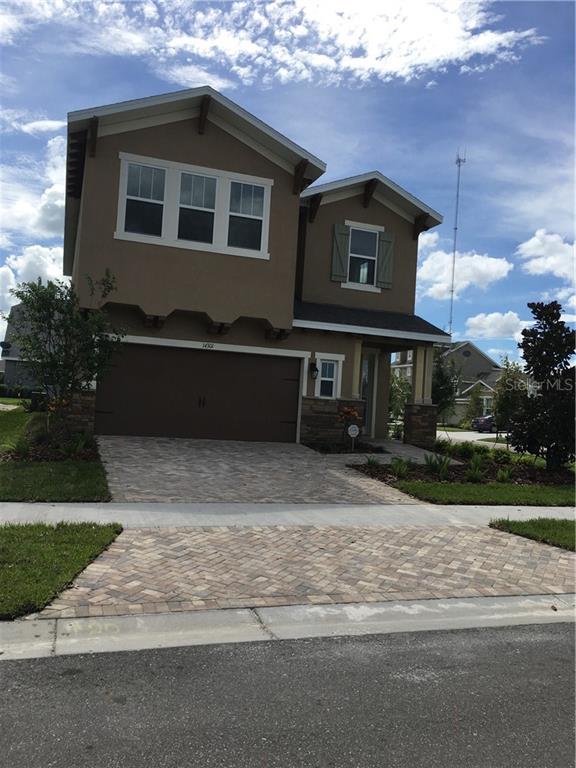 14301 Parkside Ridge Way Lithia, FL 33547 - Photo 1 of 1 a front view of a house with a yard