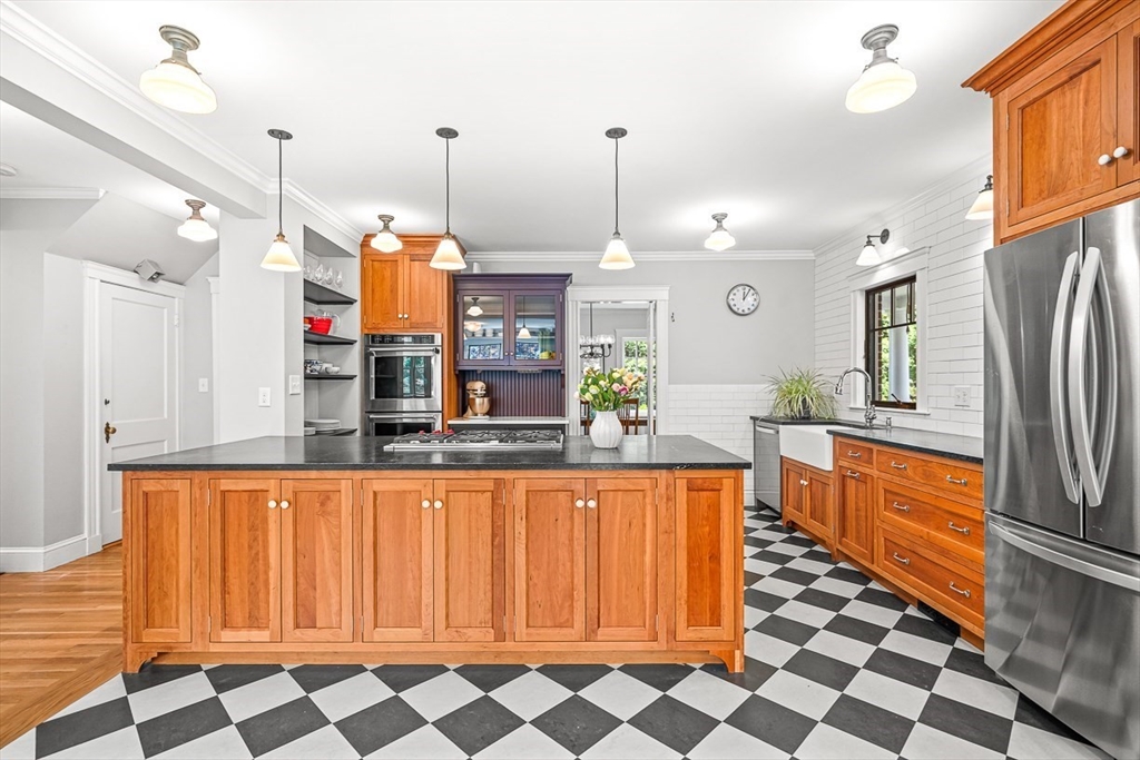 34 Rangeley Road Winchester, MA 01890 - Photo 14 of 42 a large kitchen with stainless steel appliances a refrigerator and a stove