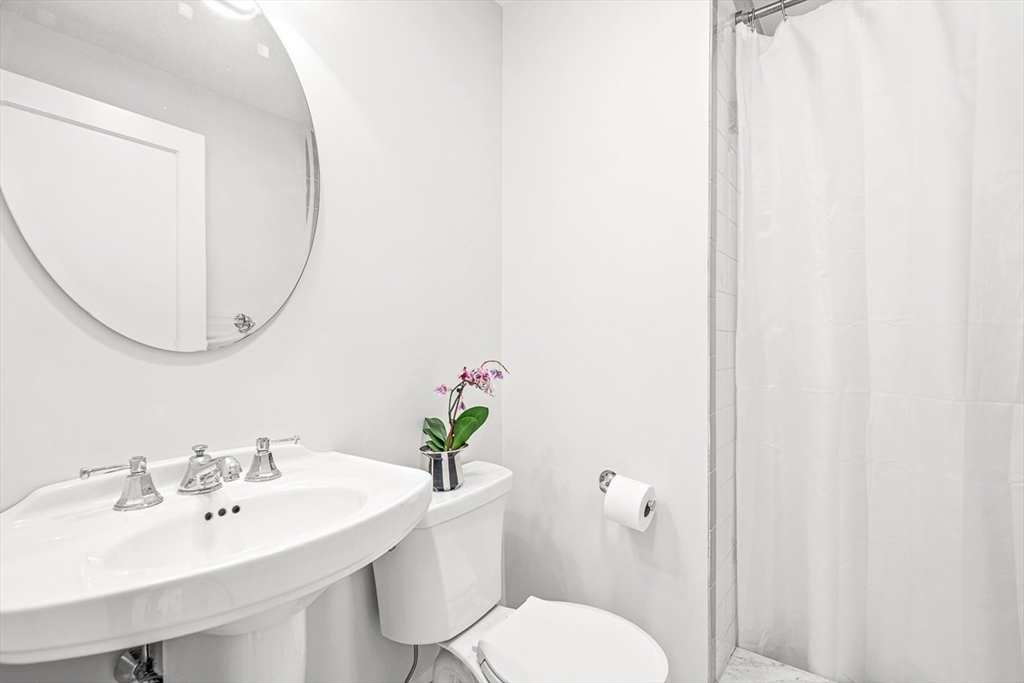 34 Rangeley Road Winchester, MA 01890 - Photo 23 of 42 a bathroom with a sink toilet and a mirror