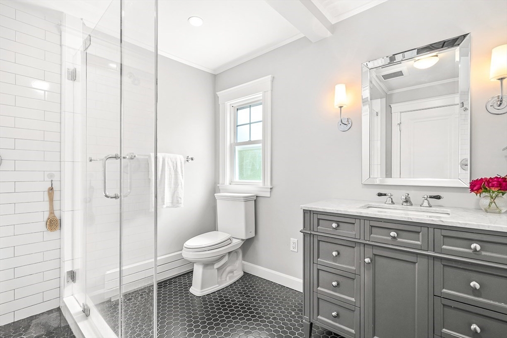 34 Rangeley Road Winchester, MA 01890 - Photo 26 of 42 a bathroom with a sink toilet a shower and a mirror