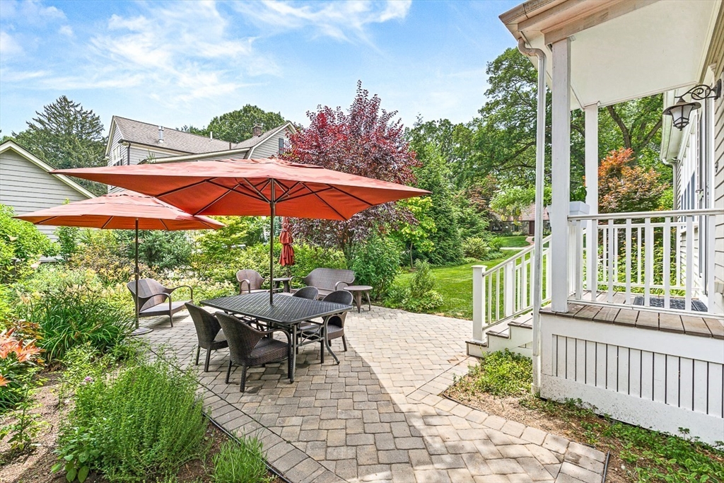 34 Rangeley Road Winchester, MA 01890 - Photo 3 of 42 a view of a patio with a table and chairs under an umbrella
