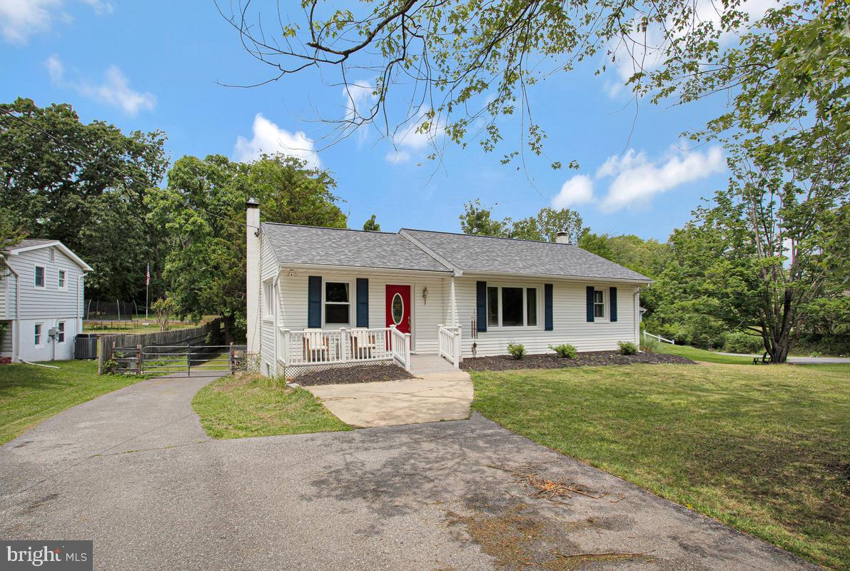 976 Shore Acres Road Arnold, MD 21012 - Photo 4 of 40 front view of a house with a yard
