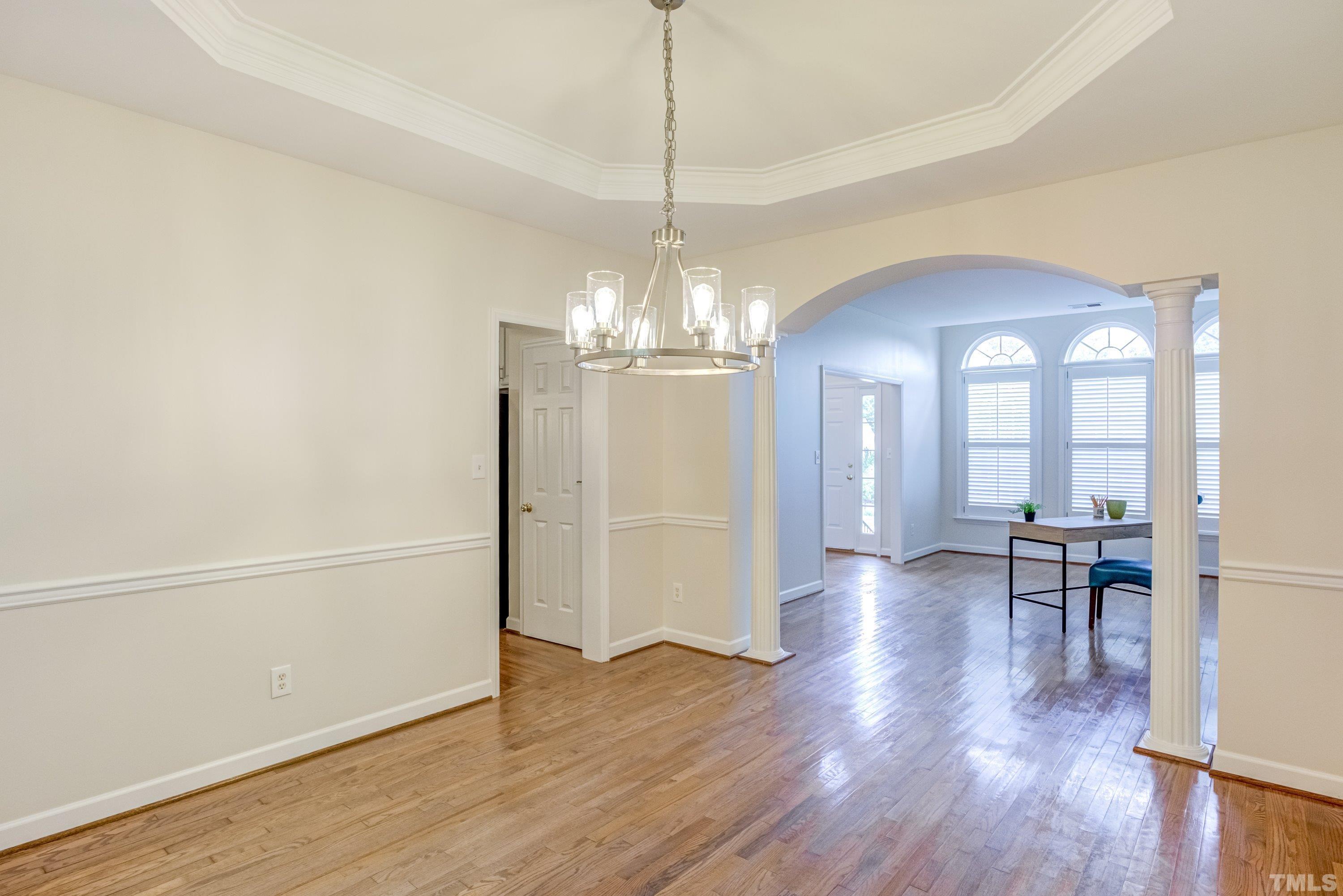 467 Seastone Street Raleigh, NC 27603 - Photo 11 of 38 a view of a room with wooden floor seating and kitchen view