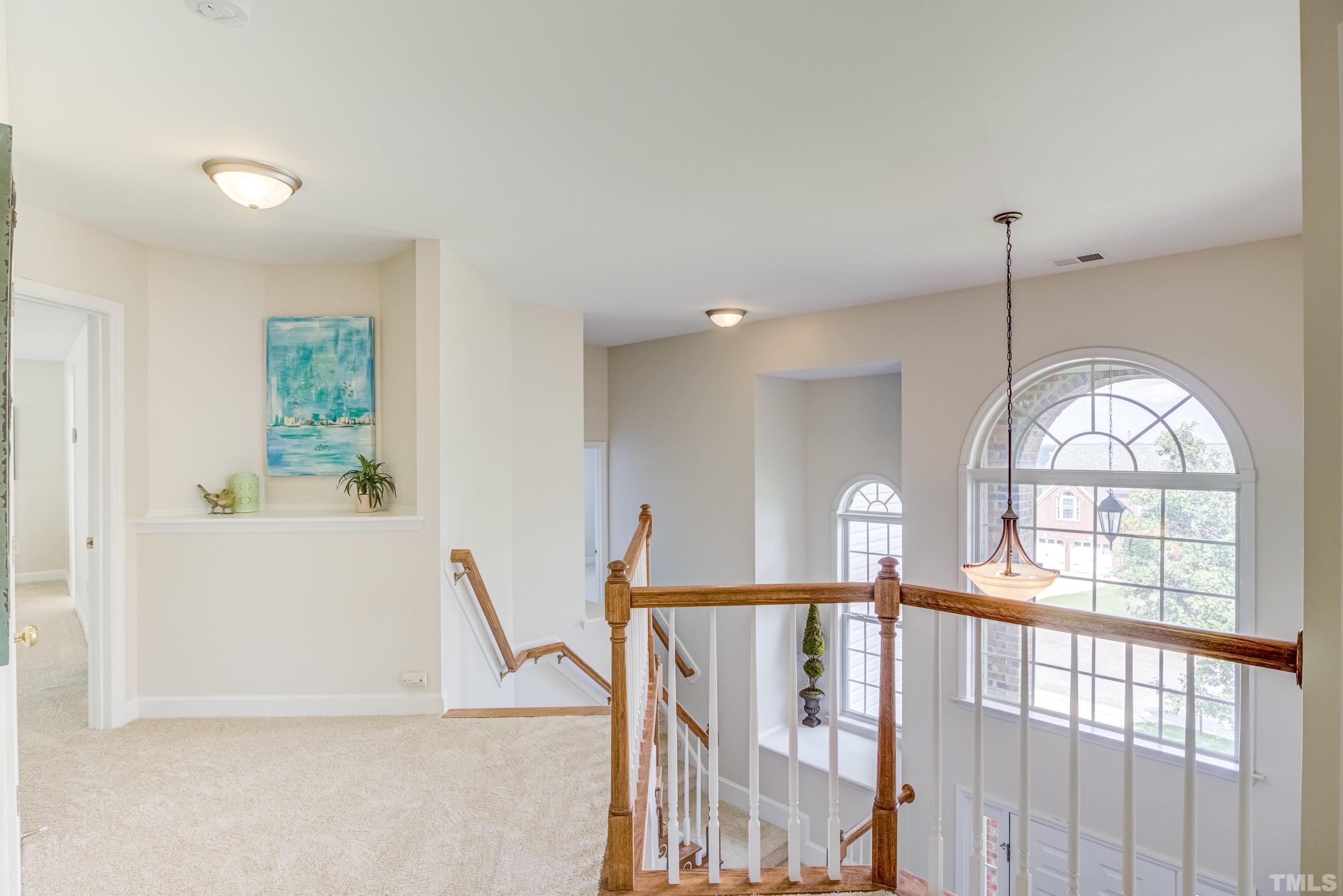 467 Seastone Street Raleigh, NC 27603 - Photo 23 of 38 a view of empty room with wooden floor and window