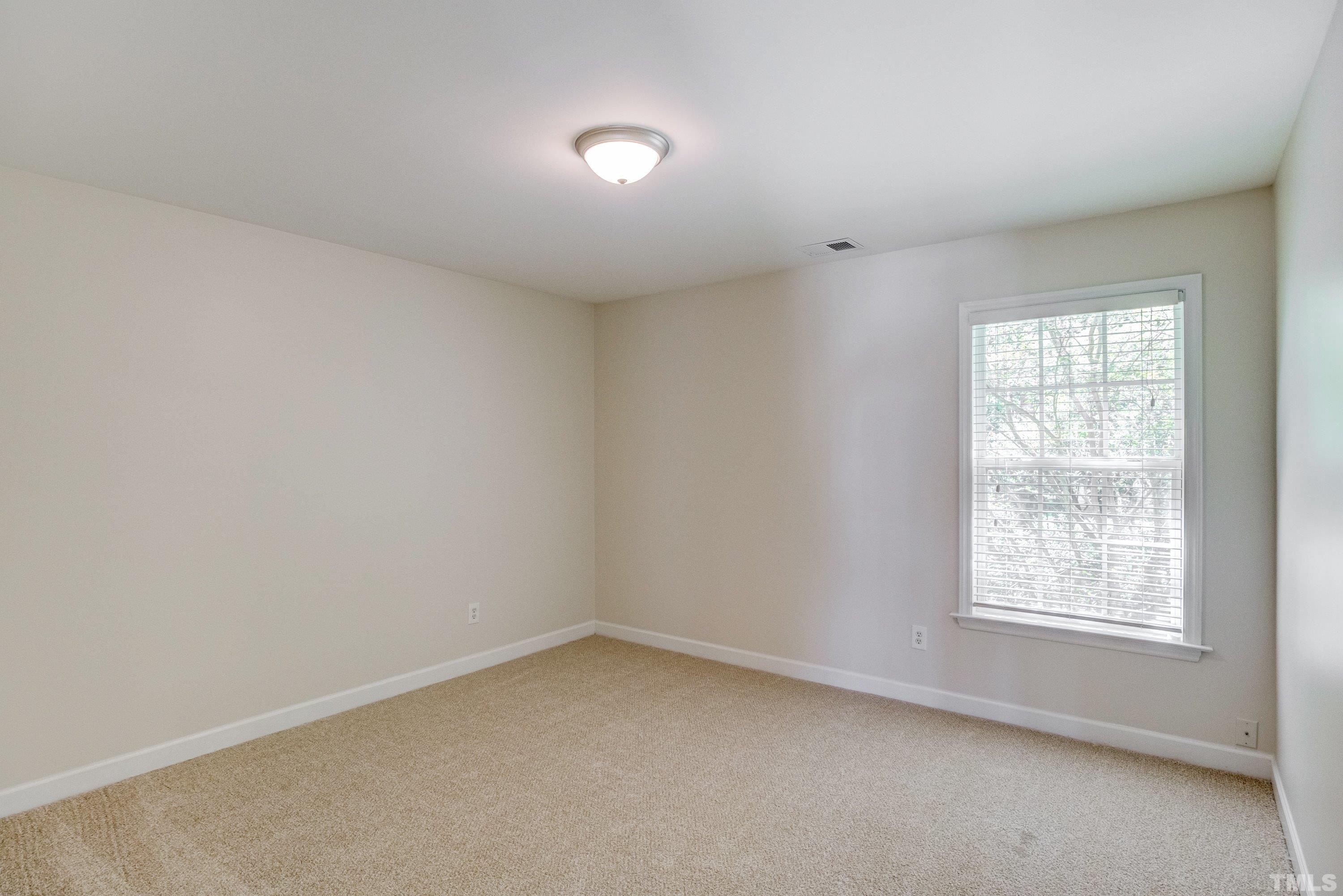 467 Seastone Street Raleigh, NC 27603 - Photo 24 of 38 an empty room with a window