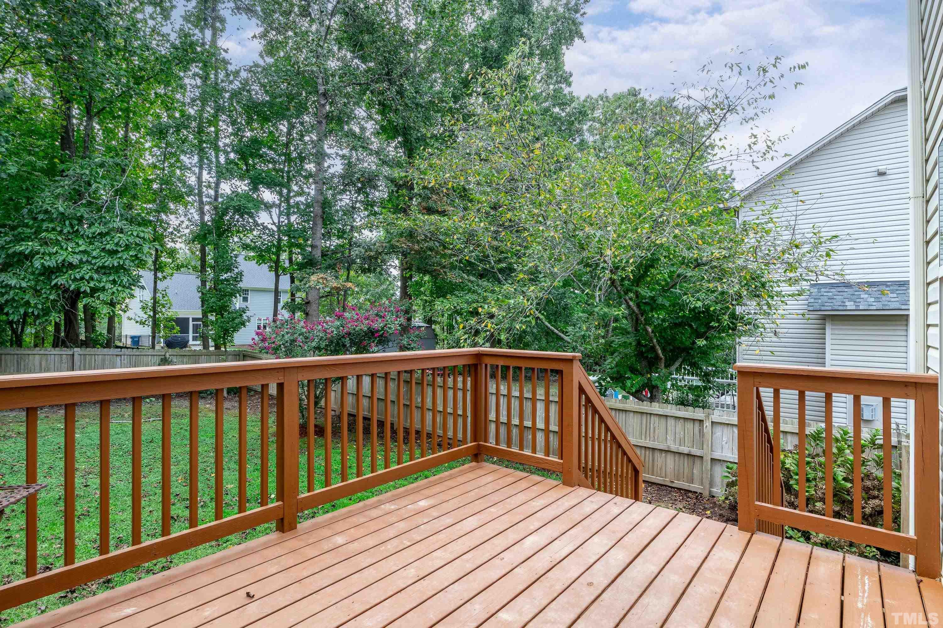 467 Seastone Street Raleigh, NC 27603 - Photo 37 of 38 a view of balcony with wooden floor and fence