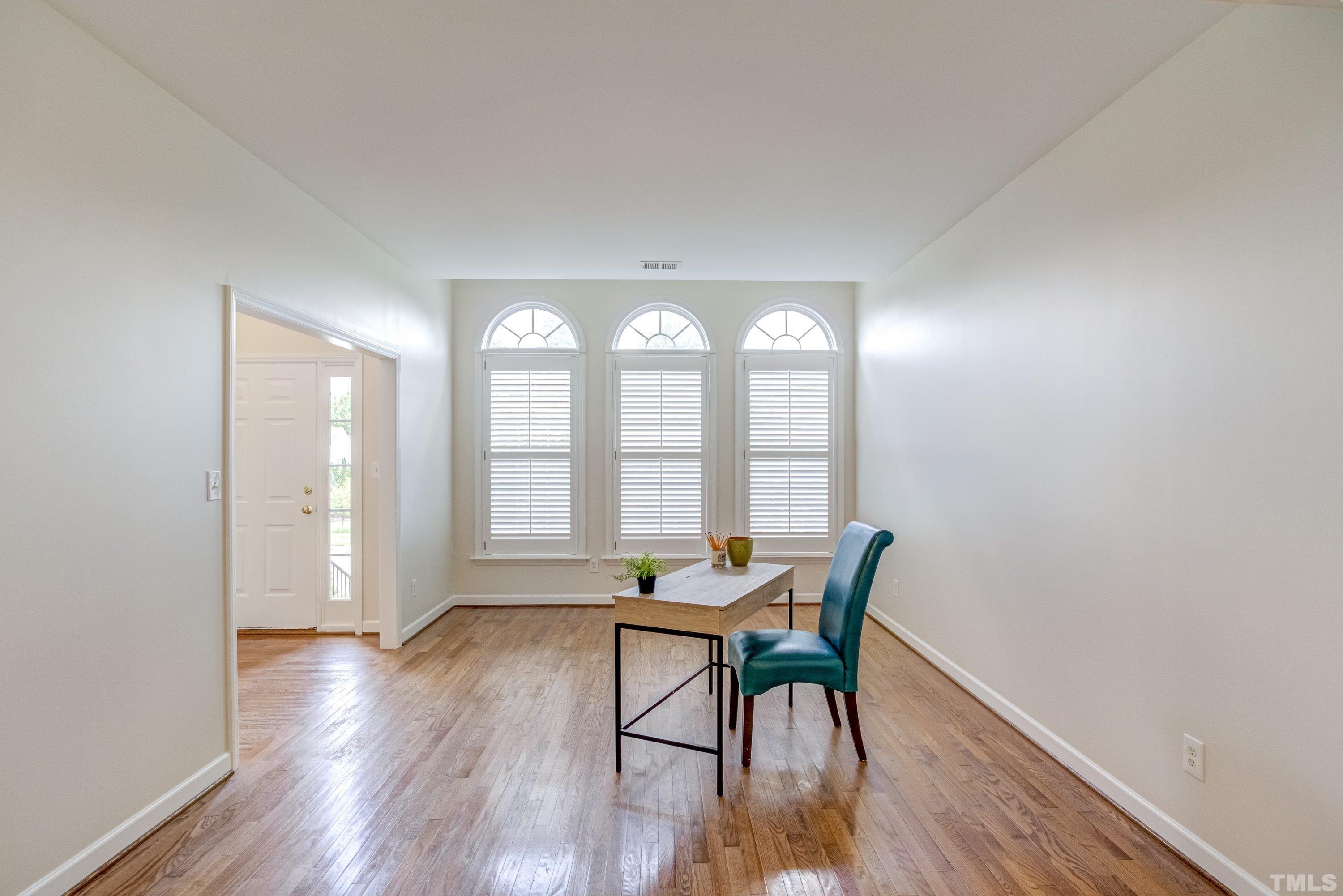 467 Seastone Street Raleigh, NC 27603 - Photo 8 of 38 a workspace room with furniture and wooden floor