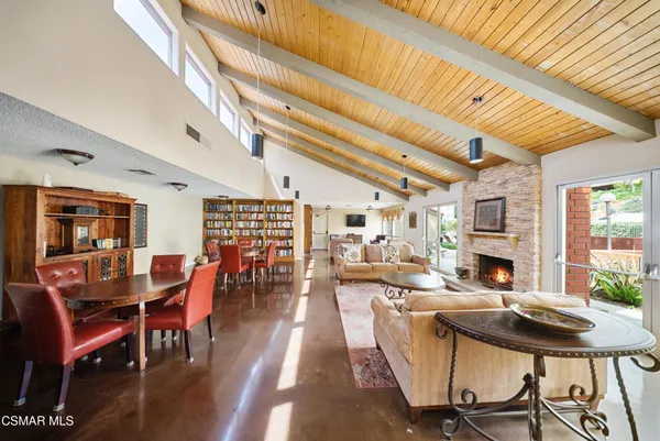 a living room with stainless steel appliances kitchen island granite countertop furniture and a kitchen view