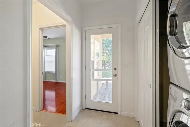 a view of a hallway with washer and dryer