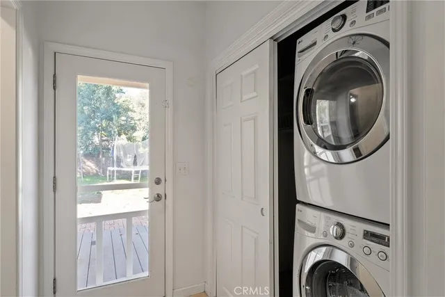 a view of a hallway with washer and dryer