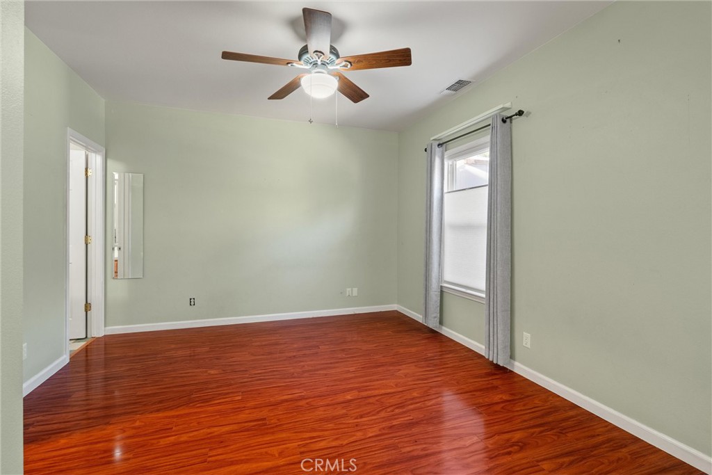 1158 East 7th Street Chico, CA 95928 - Photo 18 of 41 wooden floor in an empty room with a window