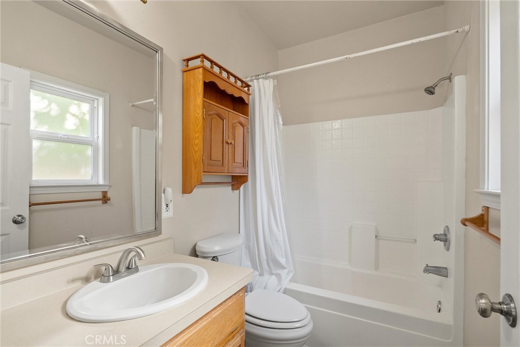 1158 East 7th Street Chico, CA 95928 - Photo 21 of 41 a bathroom with a sink toilet and shower