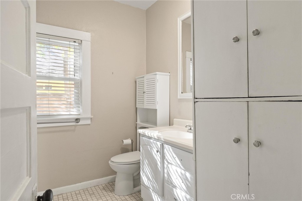 1158 East 7th Street Chico, CA 95928 - Photo 24 of 41 a bathroom with a sink a toilet and shower