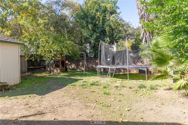 a view of a room with wooden floor and outdoor space