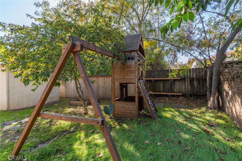 1158 East 7th Street Chico, CA 95928 - Photo 36 of 41 a view of a backyard with a slide