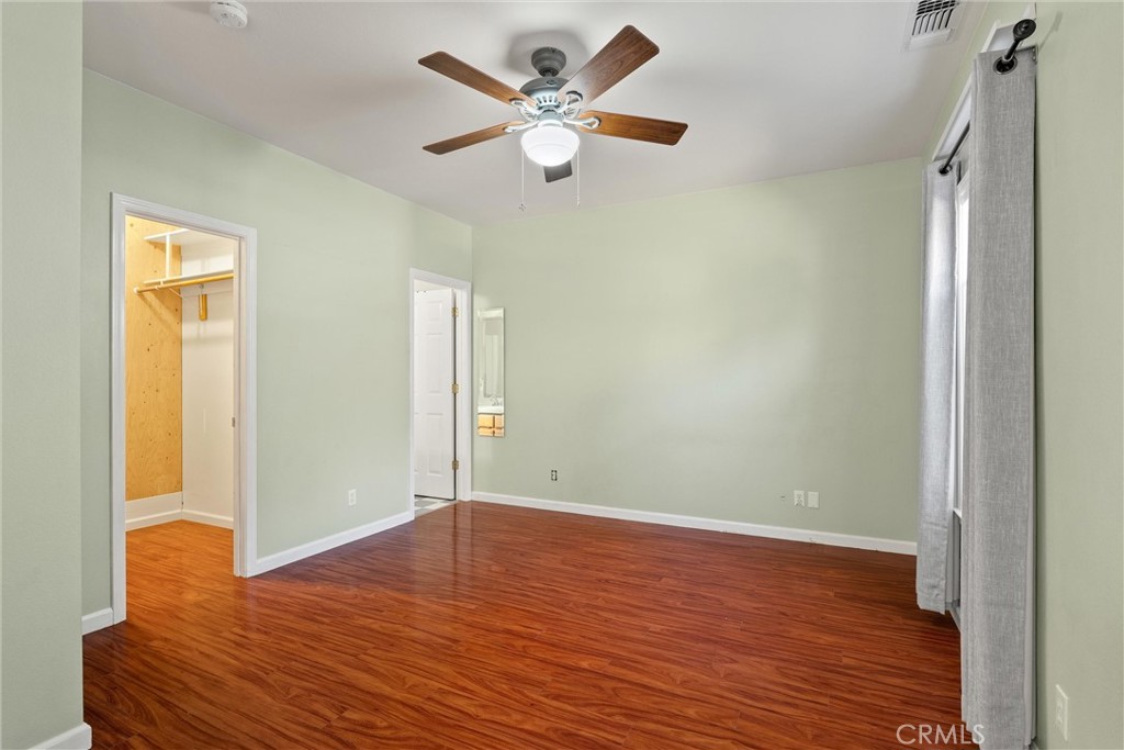 1158 East 7th Street Chico, CA 95928 - Photo 5 of 41 wooden floor in an empty room with a window