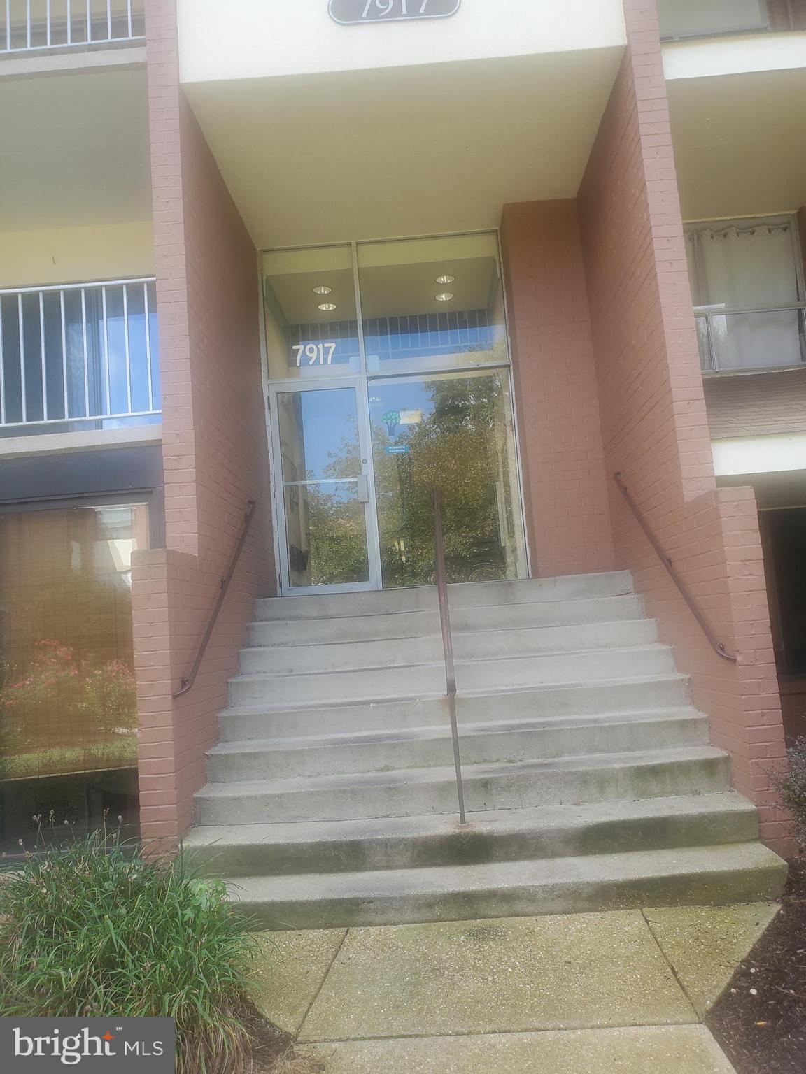 7917 Mandan Road, Unit 102 Greenbelt, MD 20770 - Photo 1 of 2 a view of staircase with white walls
