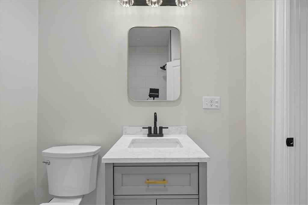 205 Spring Street Oakdale, PA 15071 - Photo 18 of 50 a bathroom with a sink toilet and mirror