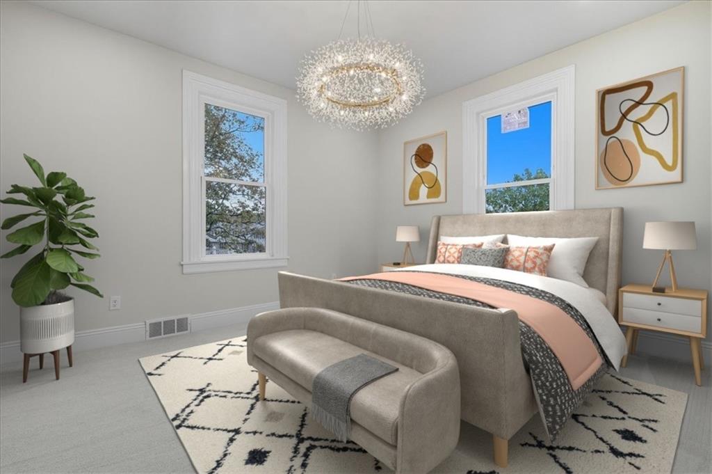 205 Spring Street Oakdale, PA 15071 - Photo 21 of 50 a bedroom with a bed and a chandelier