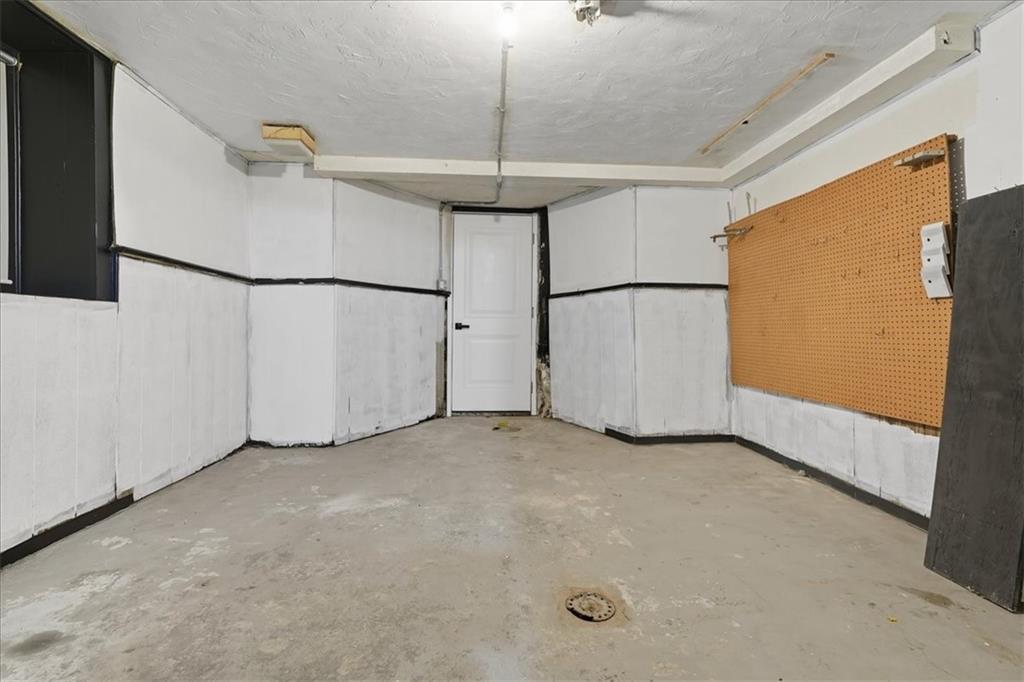 205 Spring Street Oakdale, PA 15071 - Photo 36 of 50 a view of a garage with painted walls