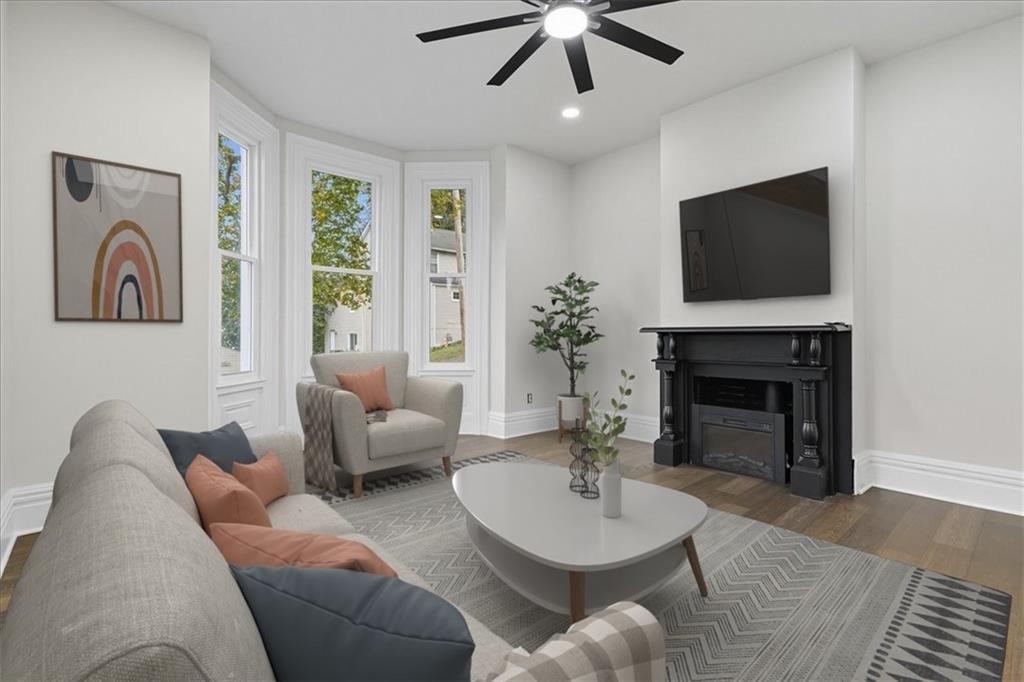 205 Spring Street Oakdale, PA 15071 - Photo 4 of 50 a living room with furniture a fireplace and a flat screen tv
