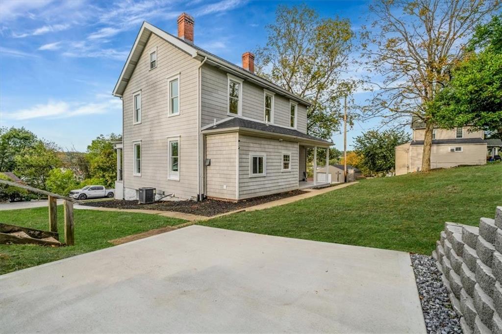 205 Spring Street Oakdale, PA 15071 - Photo 45 of 50 a view of a white house with a yard