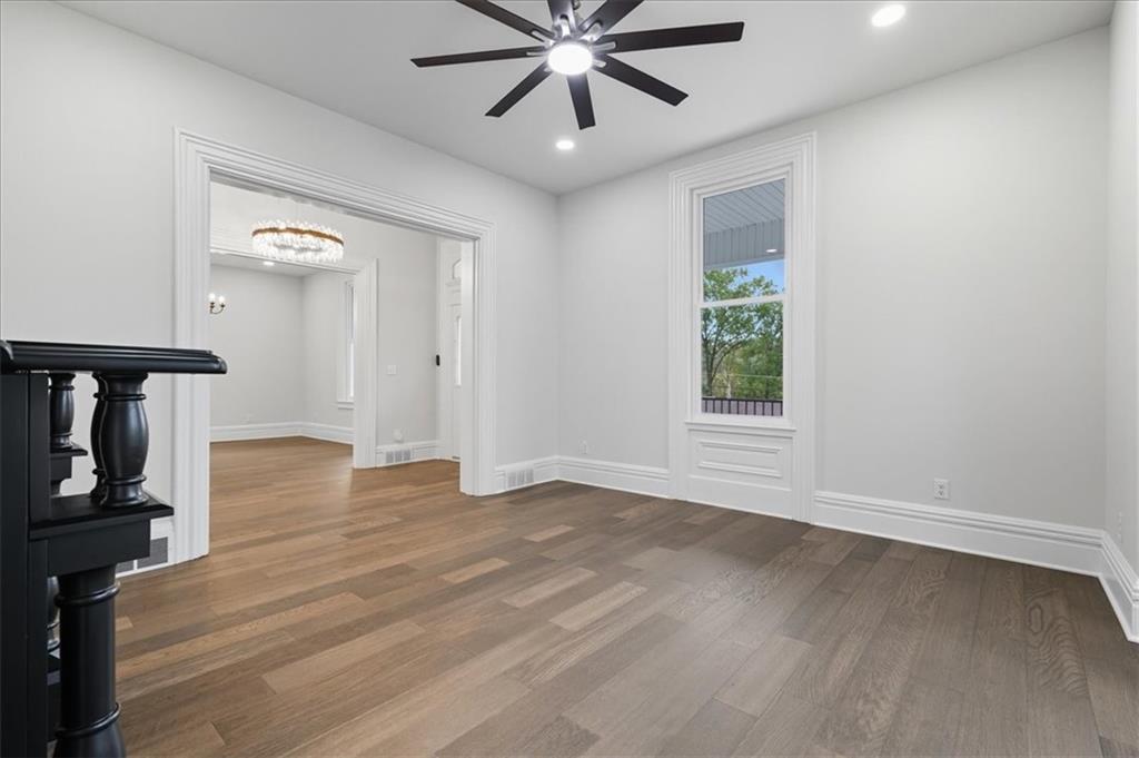 205 Spring Street Oakdale, PA 15071 - Photo 5 of 50 a view of an empty room with window and wooden floor