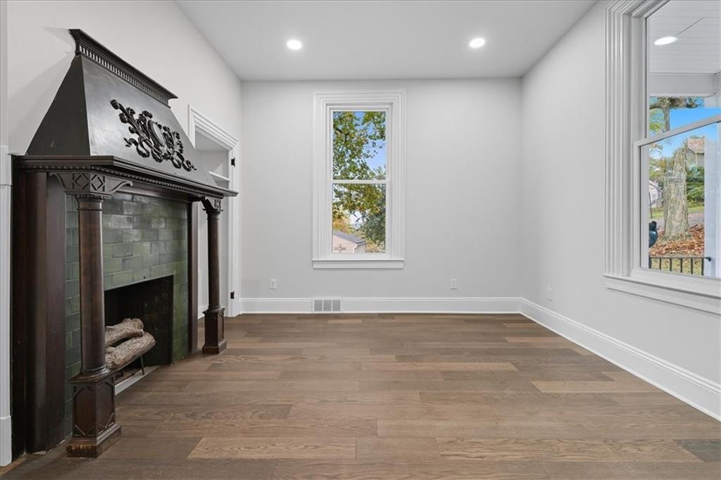 205 Spring Street Oakdale, PA 15071 - Photo 10 of 50 a view of an empty room with a fireplace and a window