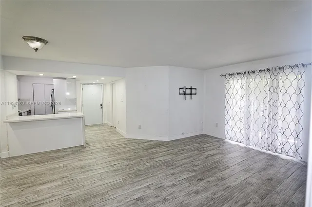 a view of an empty room and window