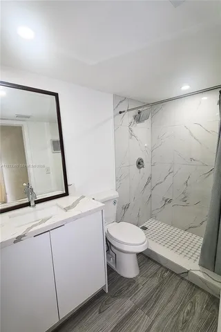 a toilet sitting next to a bathroom sink