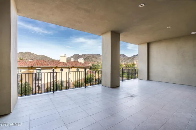 a view of a lush green hillside and a houses