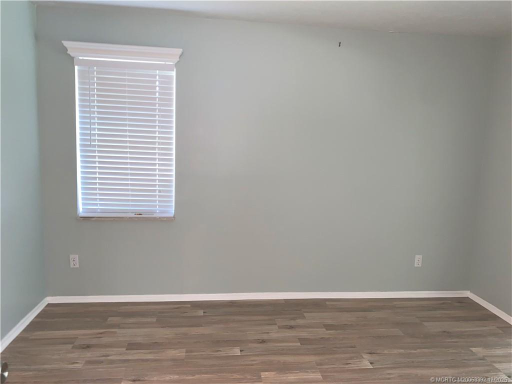 3302 Southeast Aster Lane Stuart, FL 34994 - Photo 15 of 19 a view of a small space with wooden floor and a window