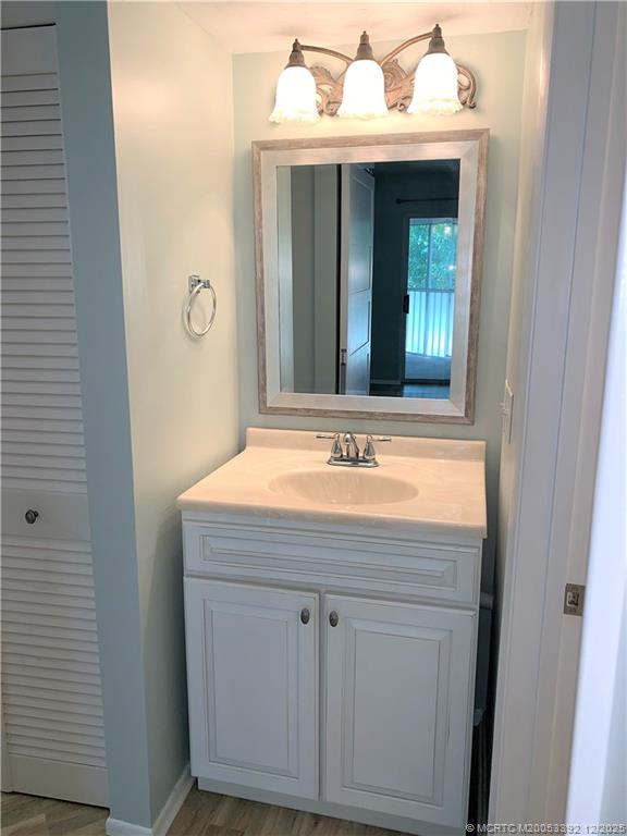 3302 Southeast Aster Lane Stuart, FL 34994 - Photo 16 of 19 a bathroom with a sink and a mirror