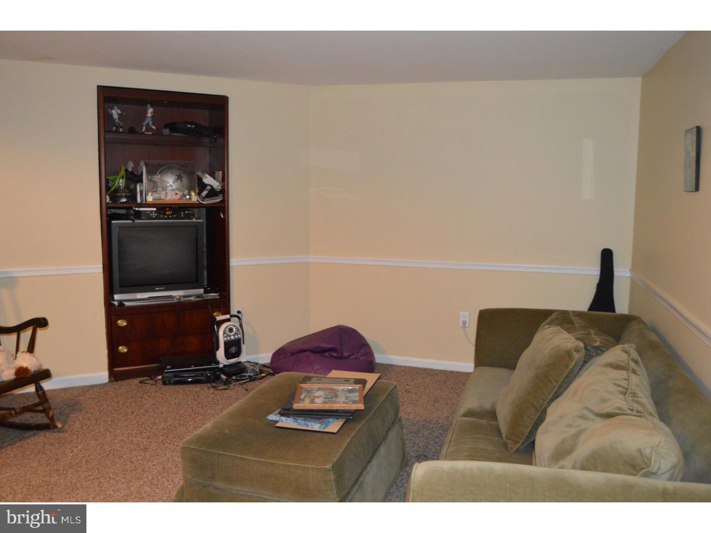 16 Dublin Road Pennington, NJ 08534 - Photo 14 of 19 a living room with furniture and a flat screen tv
