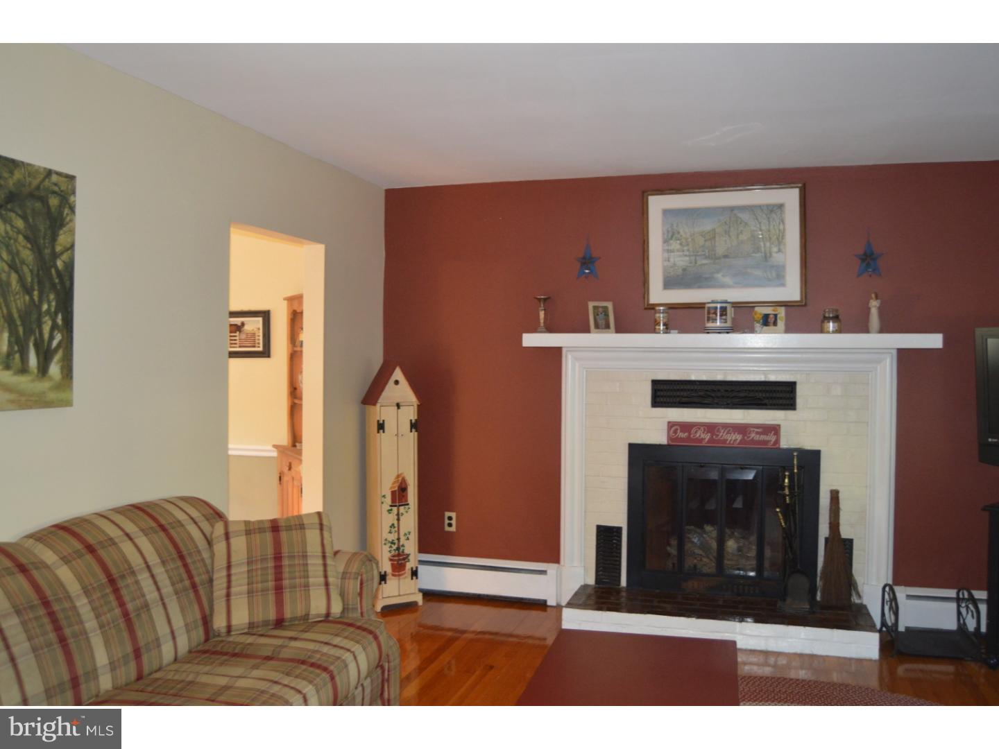 16 Dublin Road Pennington, NJ 08534 - Photo 3 of 19 a living room with furniture and a fireplace