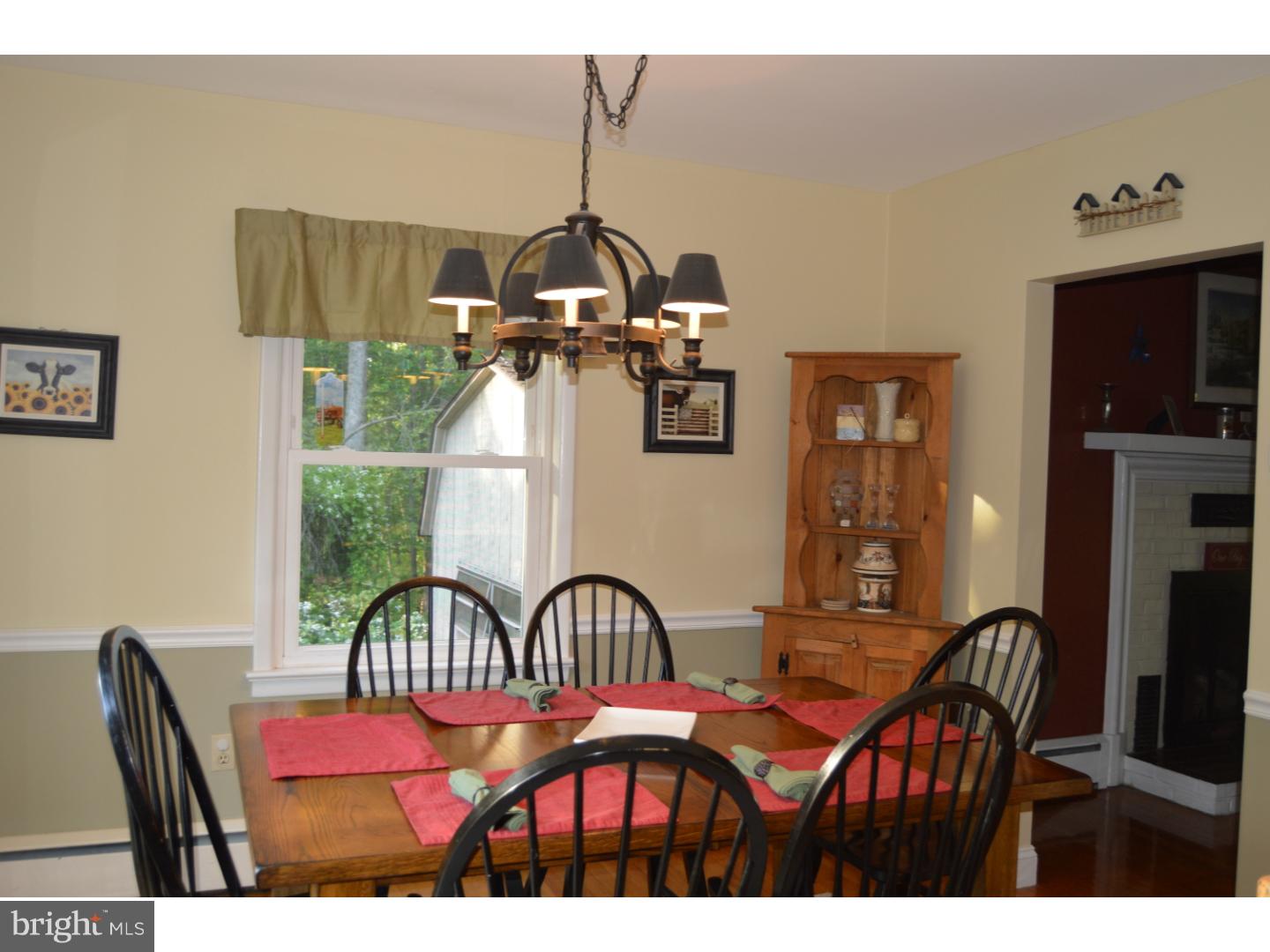 16 Dublin Road Pennington, NJ 08534 - Photo 6 of 19 a view of a dining room with furniture and chandelier